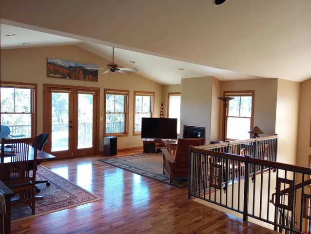 a kitchen with stainless steel appliances granite countertop a refrigerator and wooden cabinets