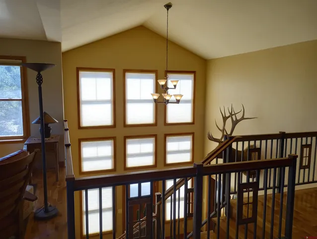a view of an entryway with wooden floor and stairs