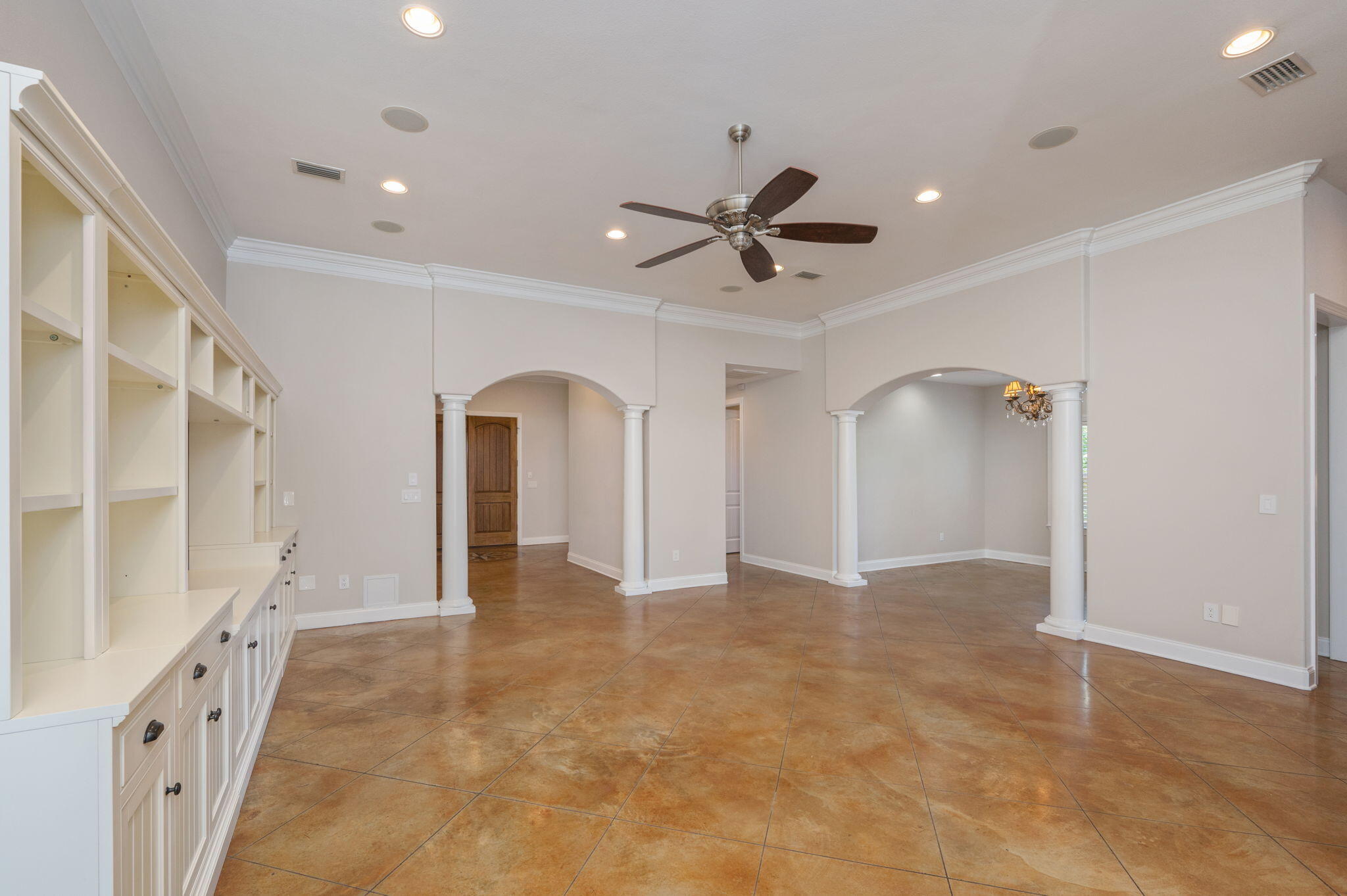 14 Blenheim Road Shalimar, FL 32579 - Photo 16 of 71 a view of an empty room with a chandelier
