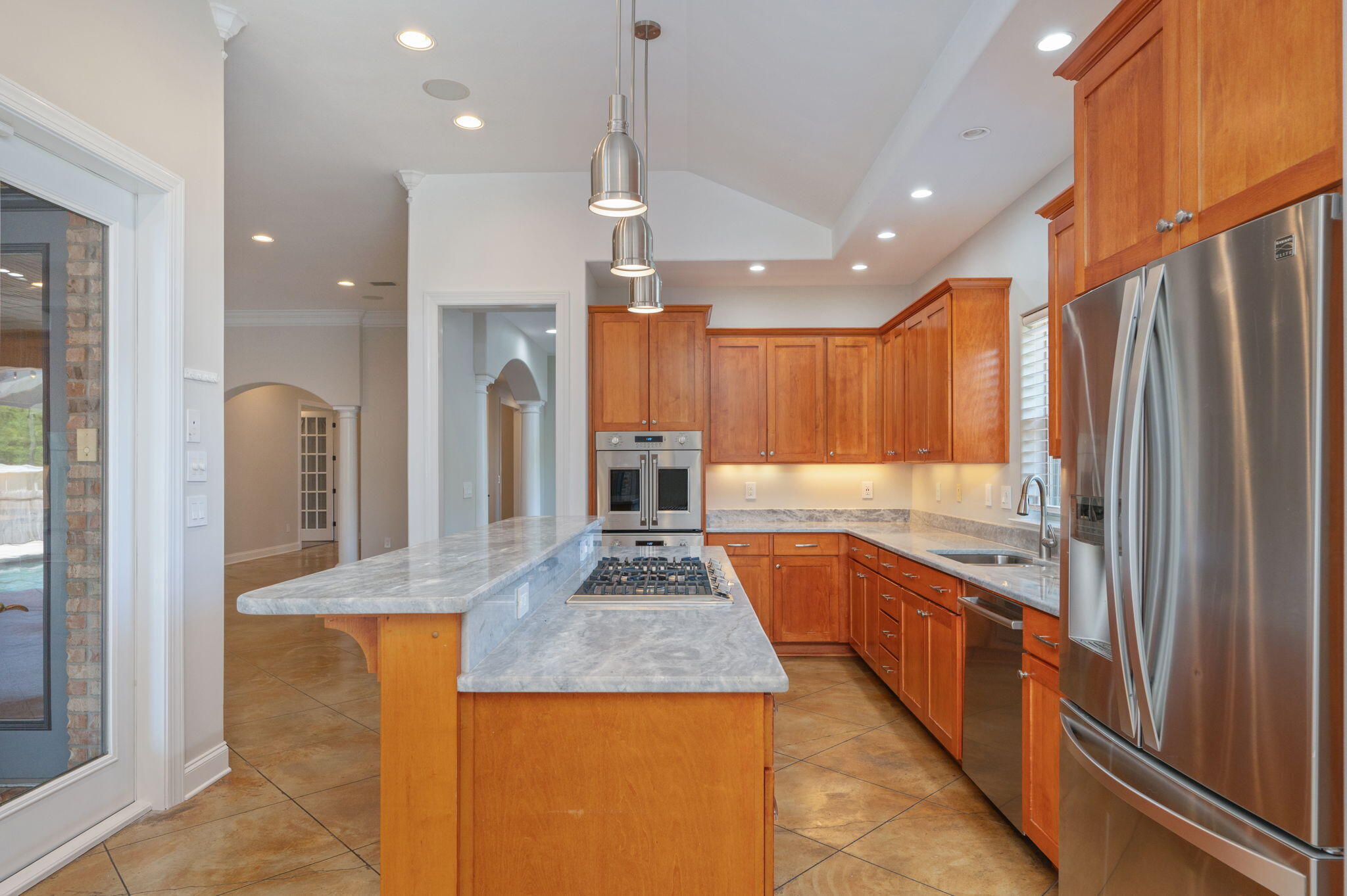 14 Blenheim Road Shalimar, FL 32579 - Photo 20 of 71 a large kitchen with stainless steel appliances granite countertop a sink and a refrigerator