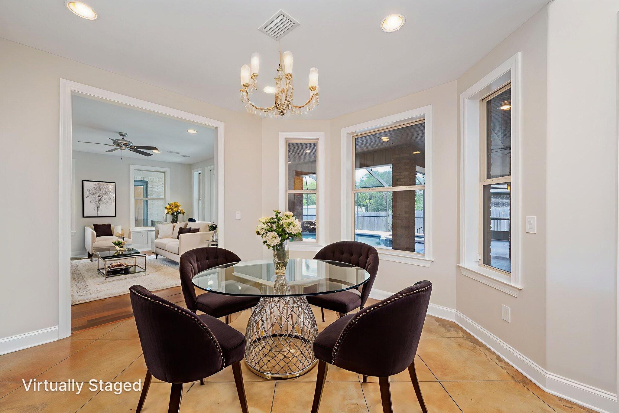 14 Blenheim Road Shalimar, FL 32579 - Photo 22 of 71 a living room with furniture and a chandelier