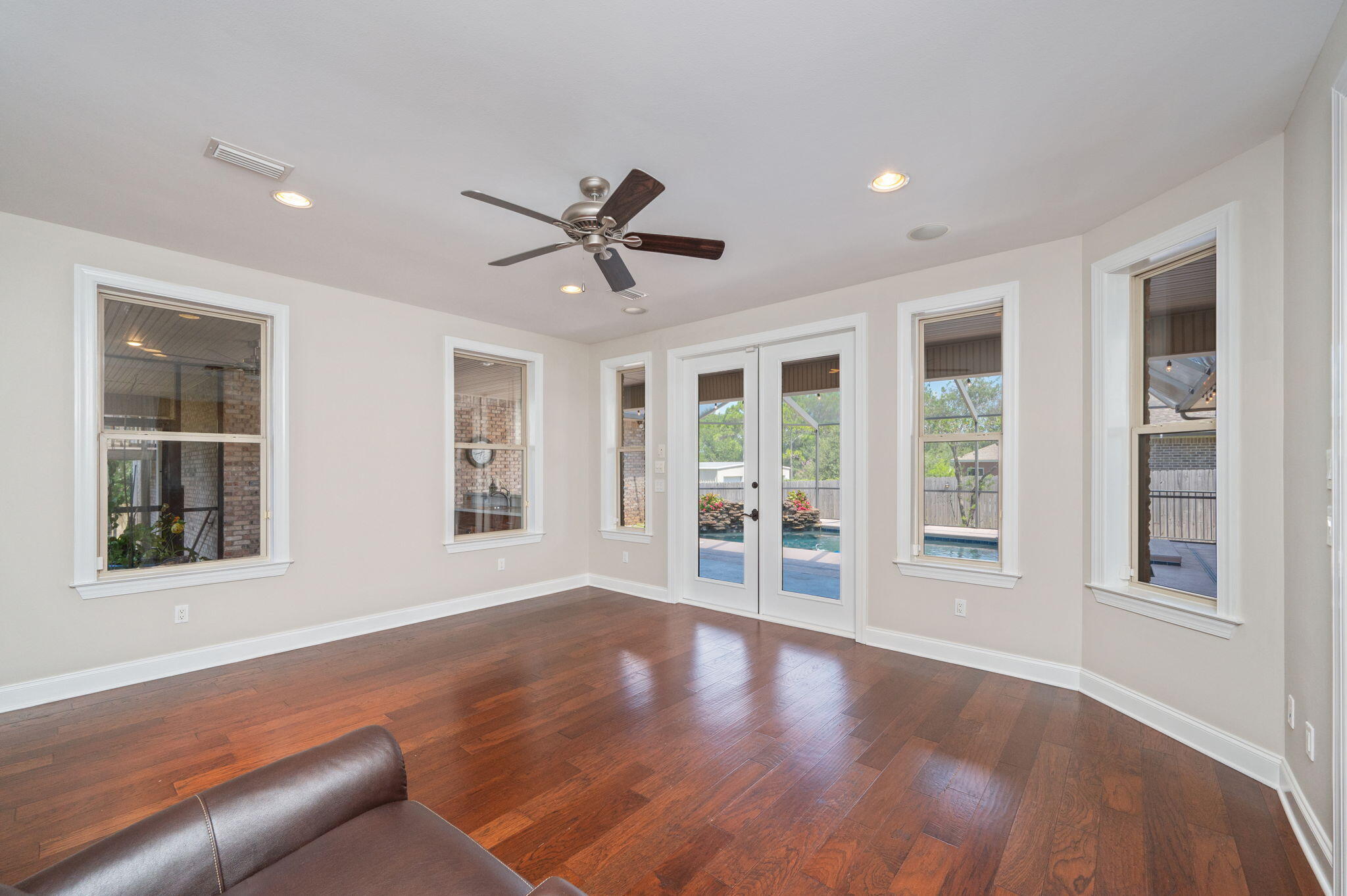 14 Blenheim Road Shalimar, FL 32579 - Photo 24 of 71 a view of an empty room with a window and wooden floor