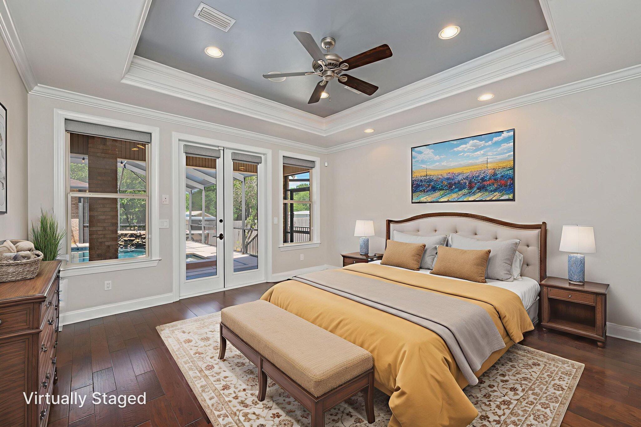 14 Blenheim Road Shalimar, FL 32579 - Photo 25 of 71 a bedroom with a large bed and a chandelier