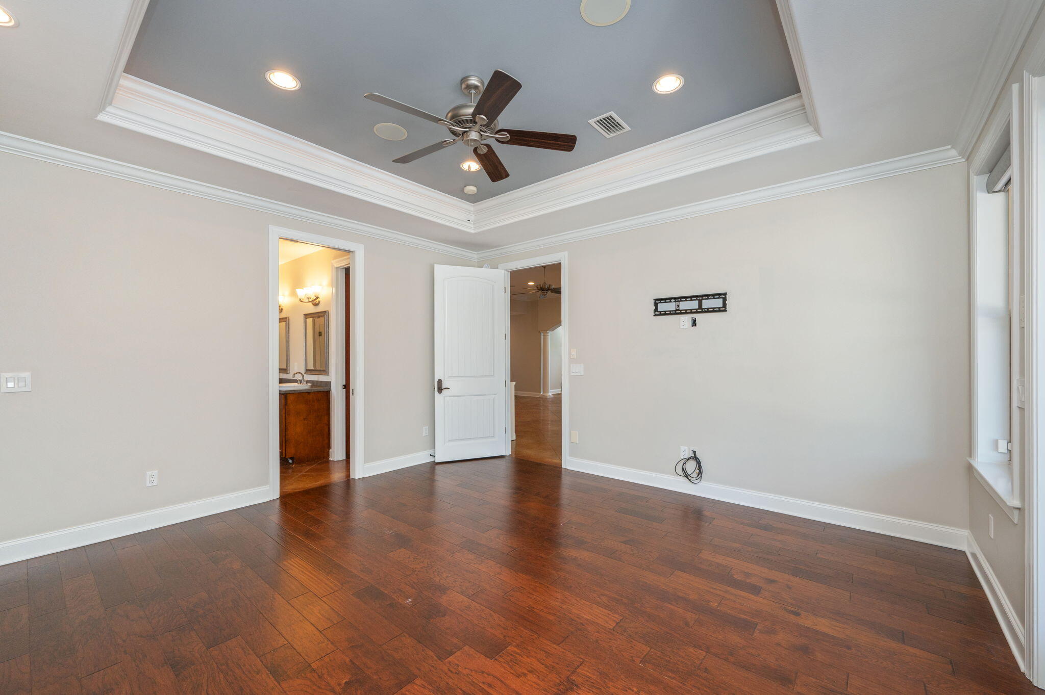 14 Blenheim Road Shalimar, FL 32579 - Photo 26 of 71 a view of an empty room with wooden floor and a ceiling fan