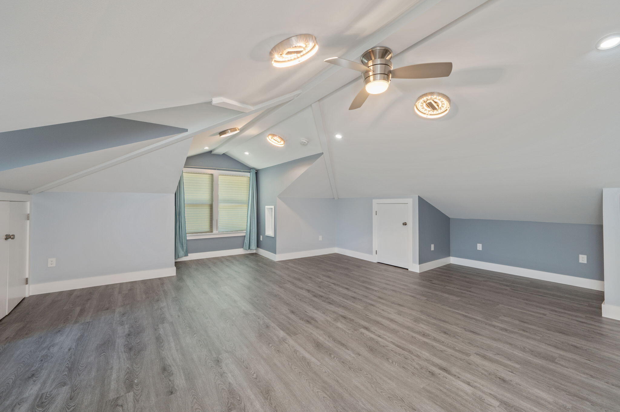 14 Blenheim Road Shalimar, FL 32579 - Photo 40 of 71 an empty room with wooden floor and windows