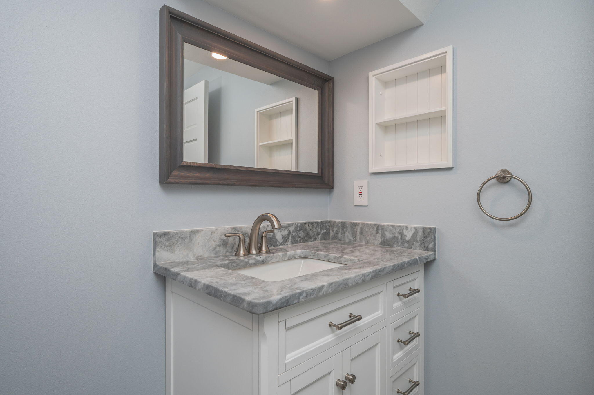 14 Blenheim Road Shalimar, FL 32579 - Photo 45 of 71 a bathroom with a sink vanity and mirror