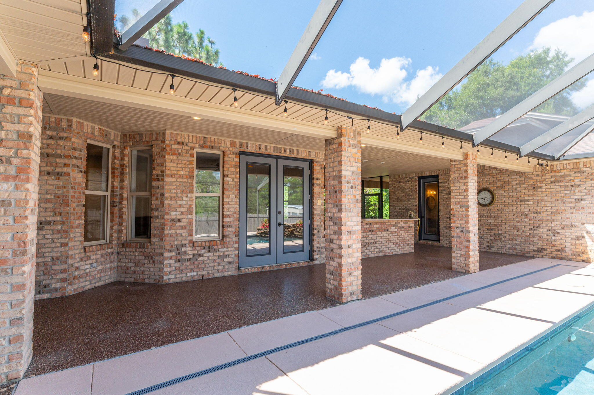 14 Blenheim Road Shalimar, FL 32579 - Photo 54 of 71 a front view of a building with glass windows and door