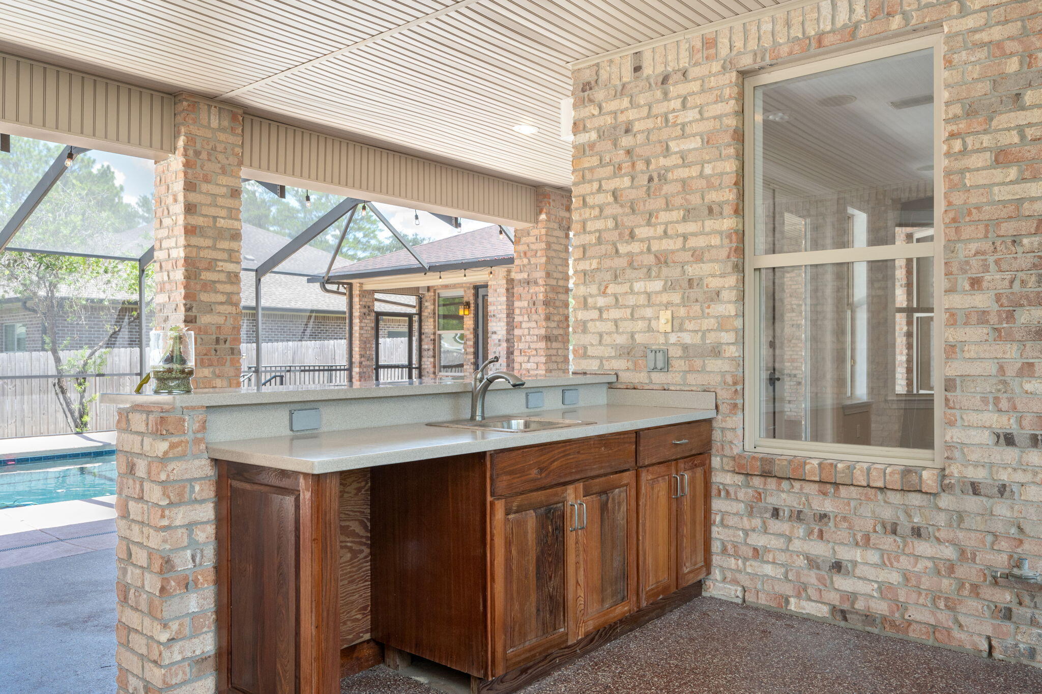14 Blenheim Road Shalimar, FL 32579 - Photo 56 of 71 a kitchen with a sink and a large window
