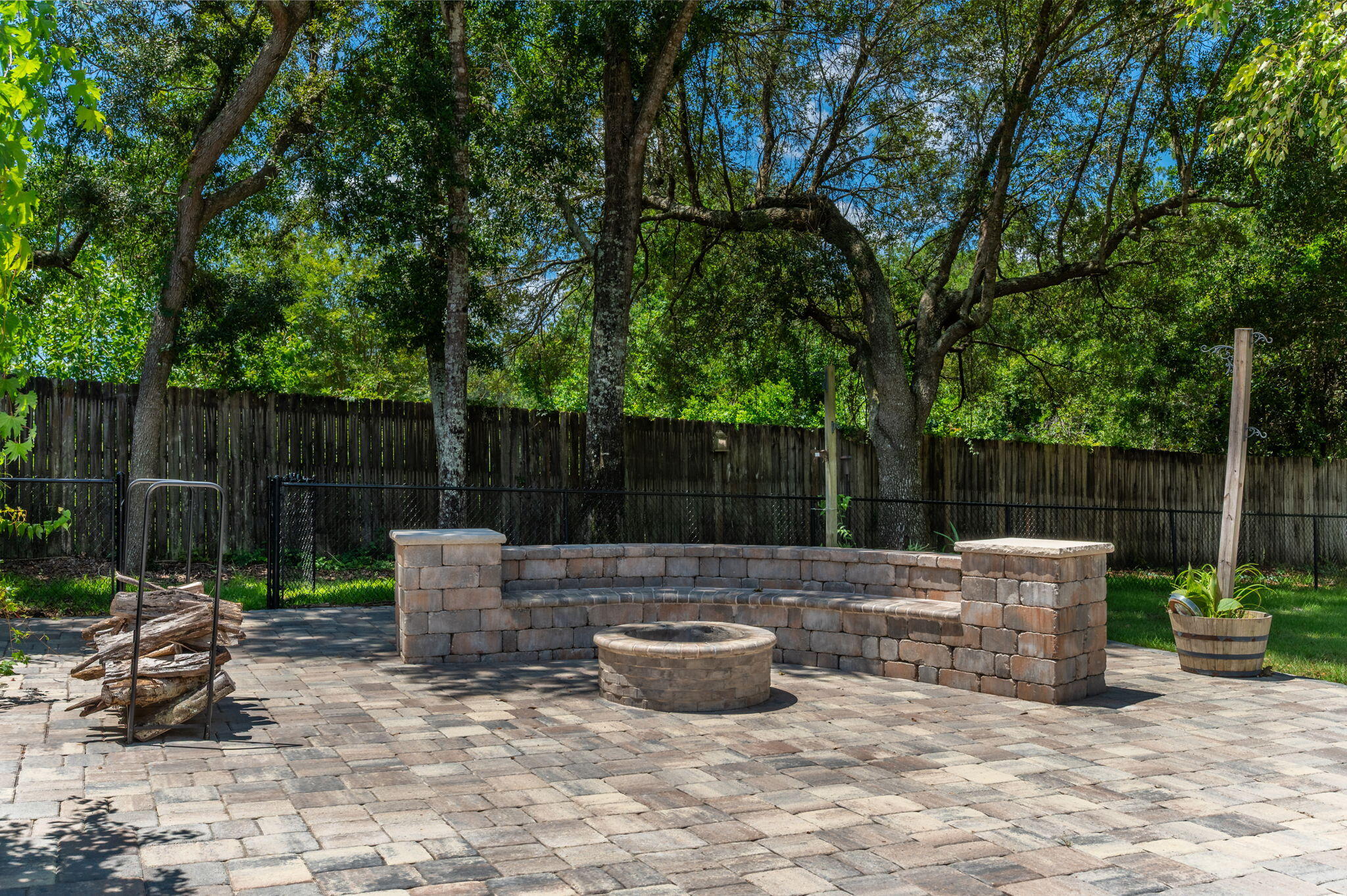 14 Blenheim Road Shalimar, FL 32579 - Photo 63 of 71 a view of a patio with table and chairs potted plants and large tree