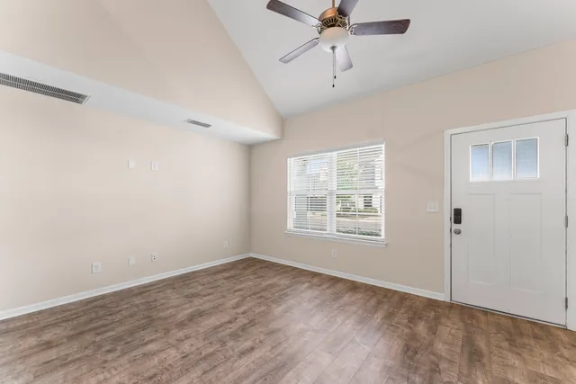 a view of an empty room with a window