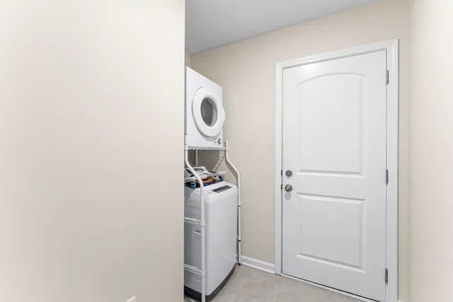 a view of a storage and utility room with washer and dryer