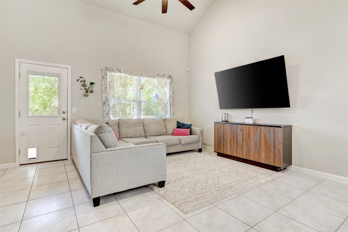 6709 Branrust Drive Austin, TX 78744 - Photo 11 of 35 a living room with furniture and a flat screen tv