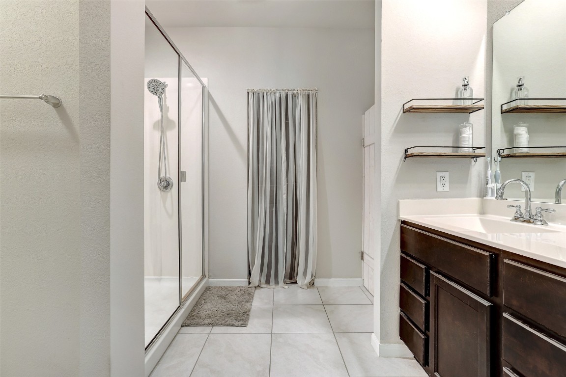 6709 Branrust Drive Austin, TX 78744 - Photo 15 of 35 a kitchen with stainless steel appliances a sink and a refrigerator
