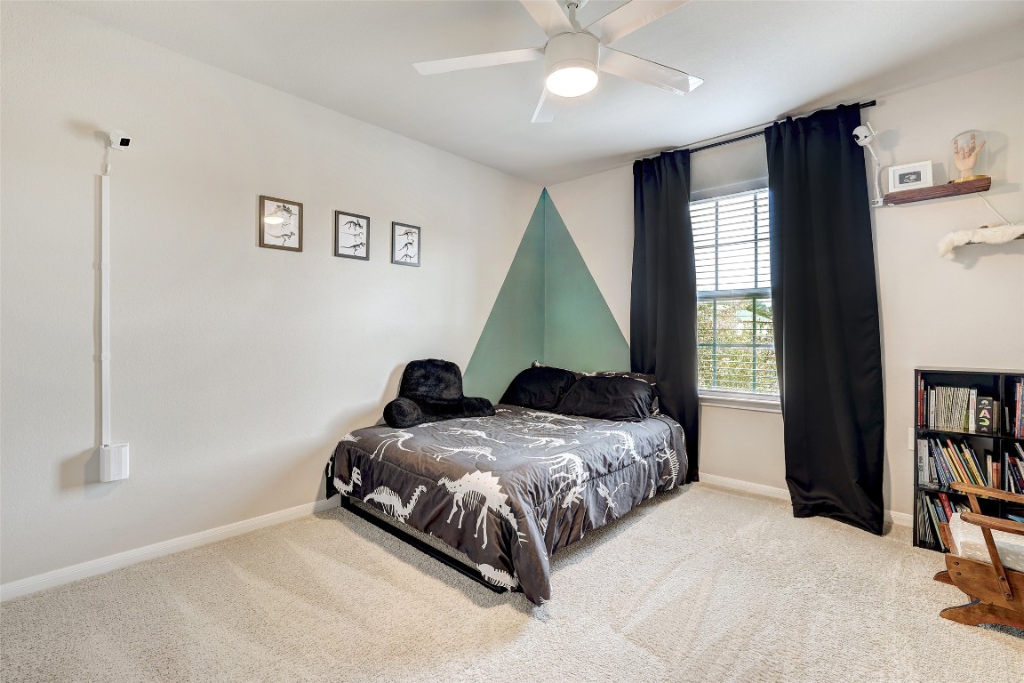 6709 Branrust Drive Austin, TX 78744 - Photo 20 of 35 a bedroom with two beds and a window