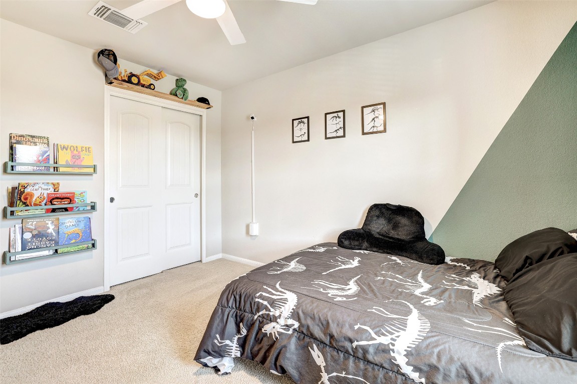 6709 Branrust Drive Austin, TX 78744 - Photo 21 of 35 a bedroom with a bed and a window