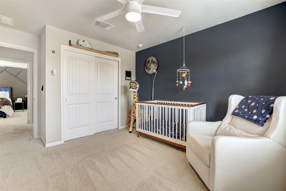 6709 Branrust Drive Austin, TX 78744 - Photo 24 of 35 a bedroom with furniture and a window
