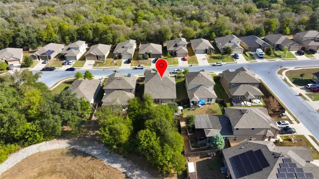 an aerial view of houses with yard