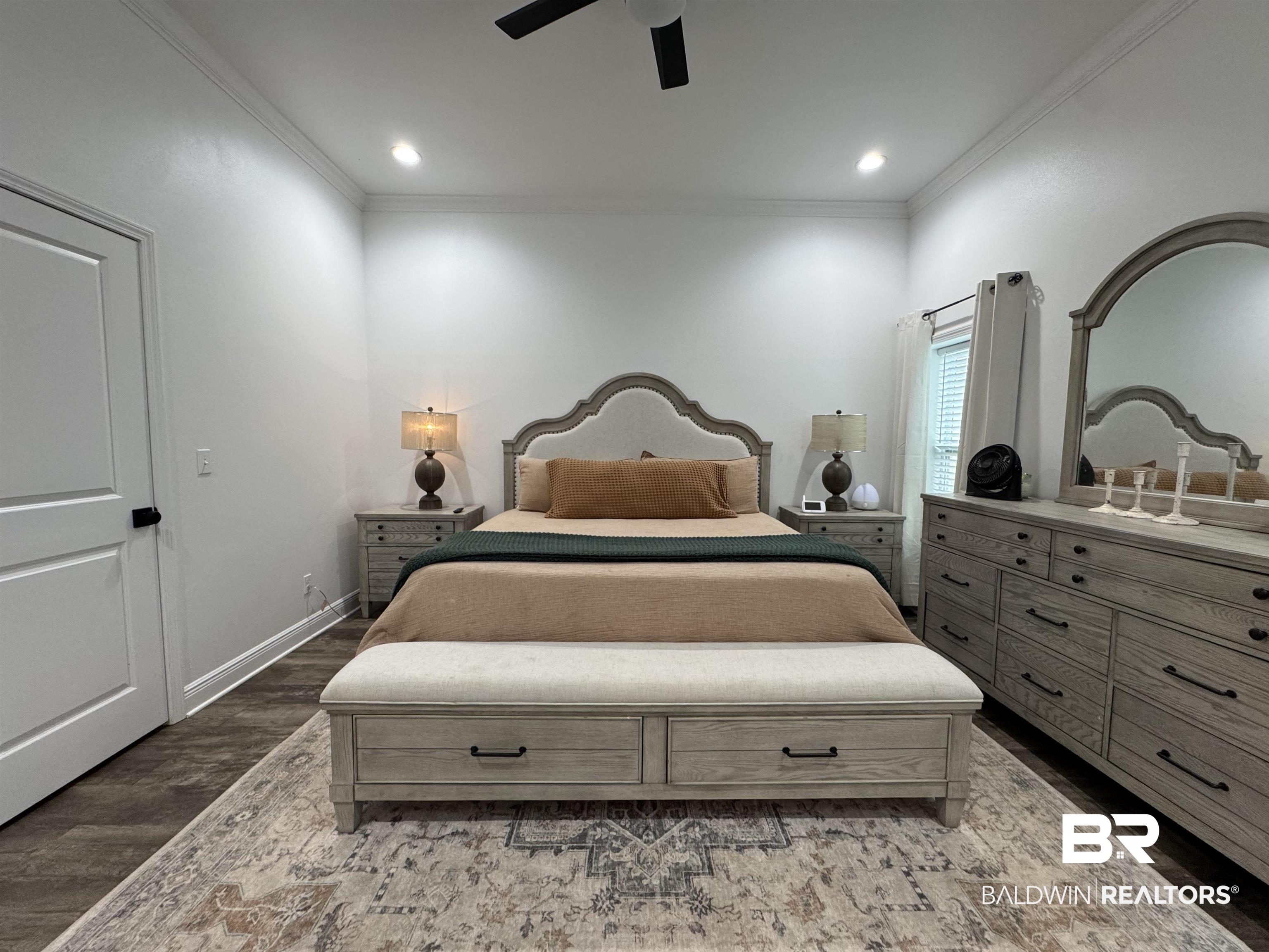 370 Dianne Road Frisco City, AL 36445 - Photo 37 of 41 Bedroom with wood-type flooring, ceiling fan, and crown molding