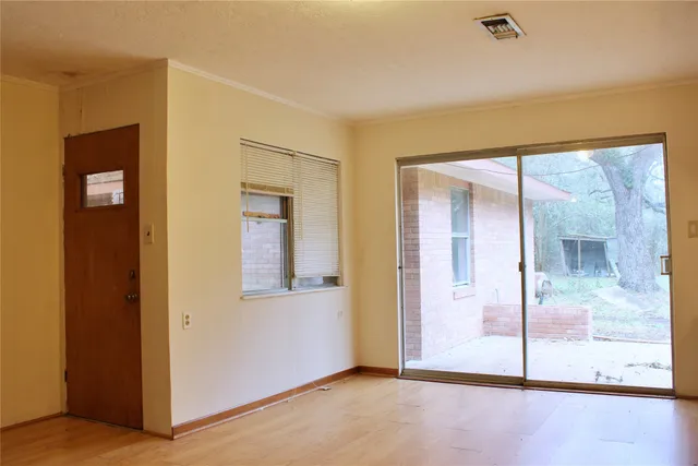 a front view of house with yard and trees
