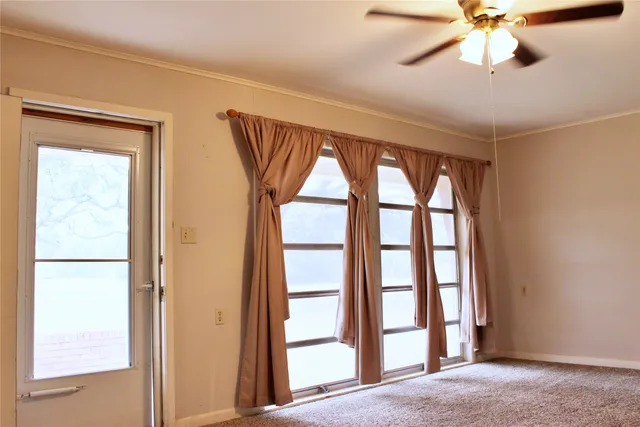 a view of a kitchen with a sink and dishwasher next to a window