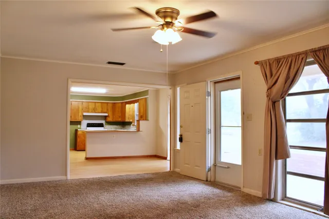 a view of an empty room with a window