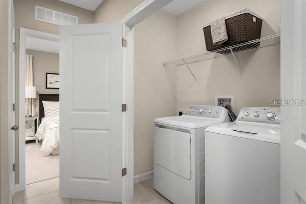 a bedroom with a bed and a night stand