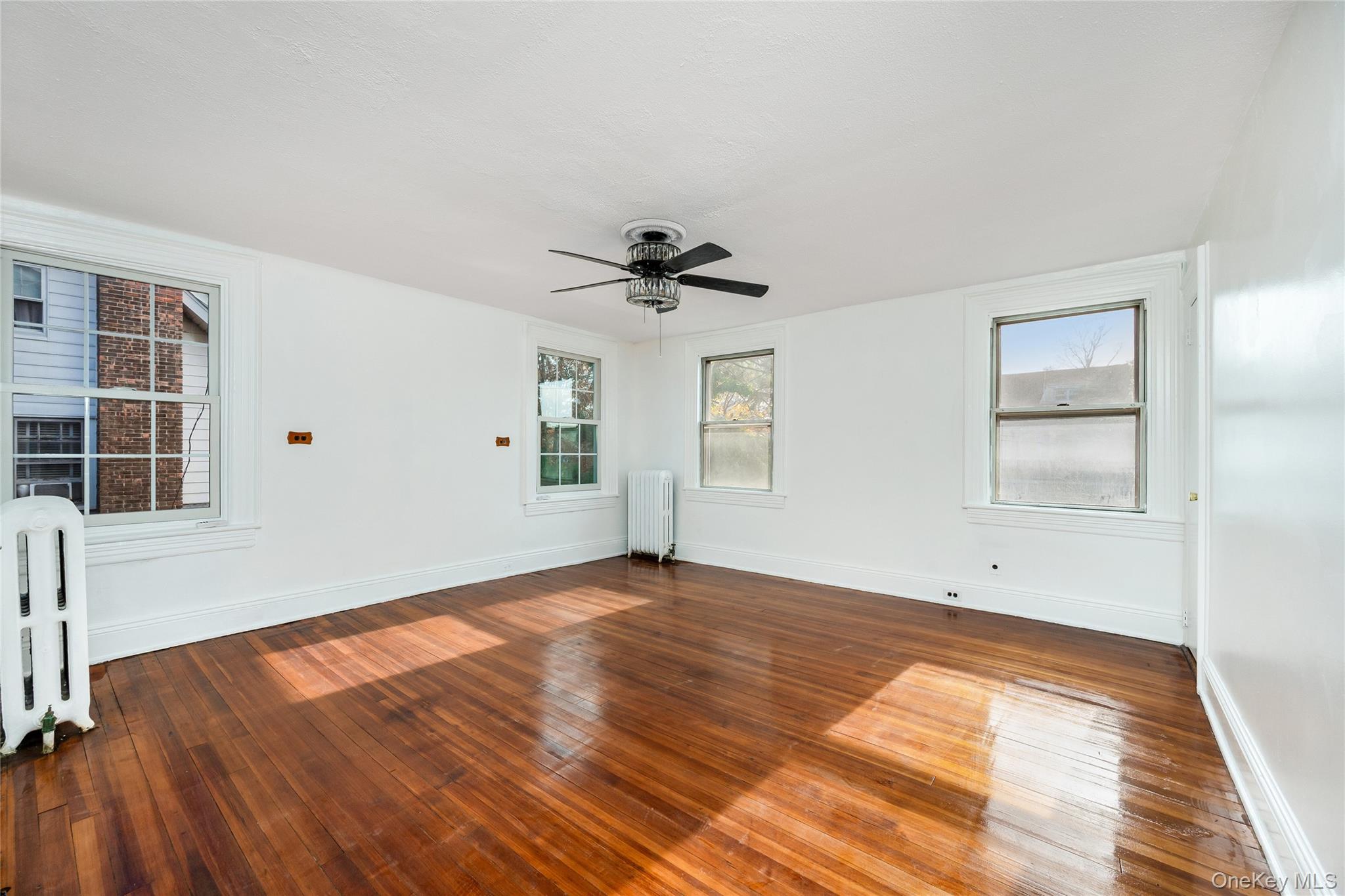 41 French Ridge New Rochelle, NY 10801 - Photo 19 of 50 wooden floor in an empty room with a window