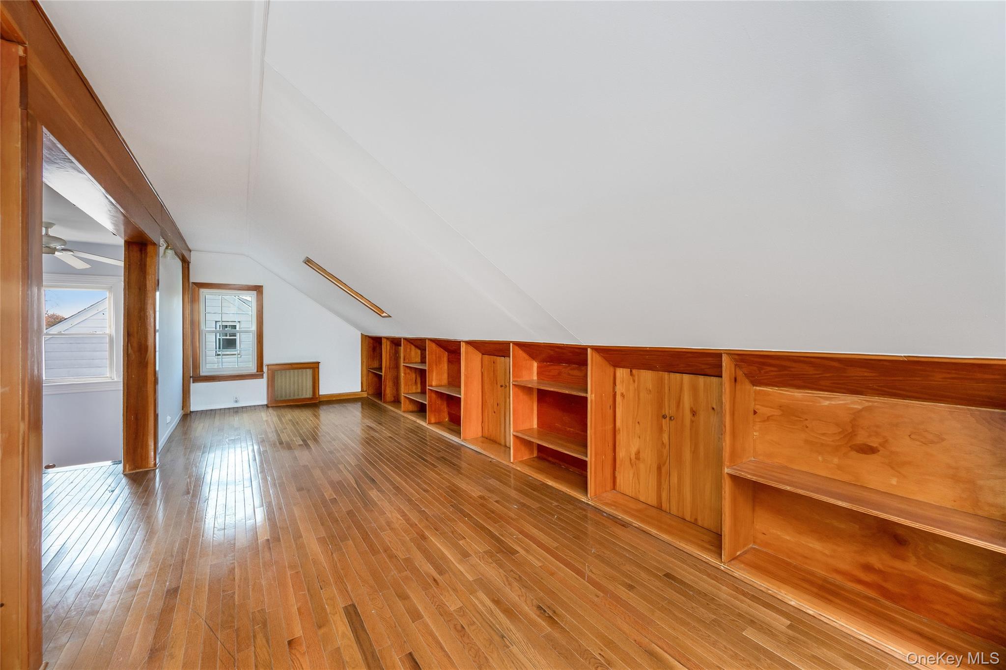 41 French Ridge New Rochelle, NY 10801 - Photo 31 of 50 a view of an empty room with wooden floor and a window