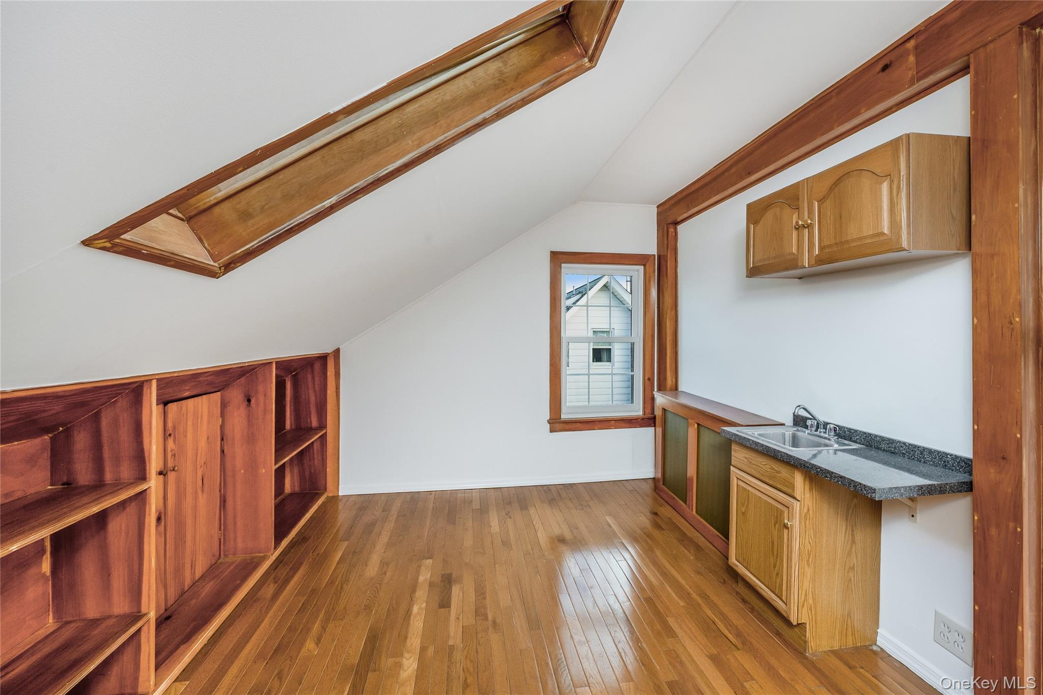 41 French Ridge New Rochelle, NY 10801 - Photo 32 of 50 a view of a hallway with wooden floor and staircase