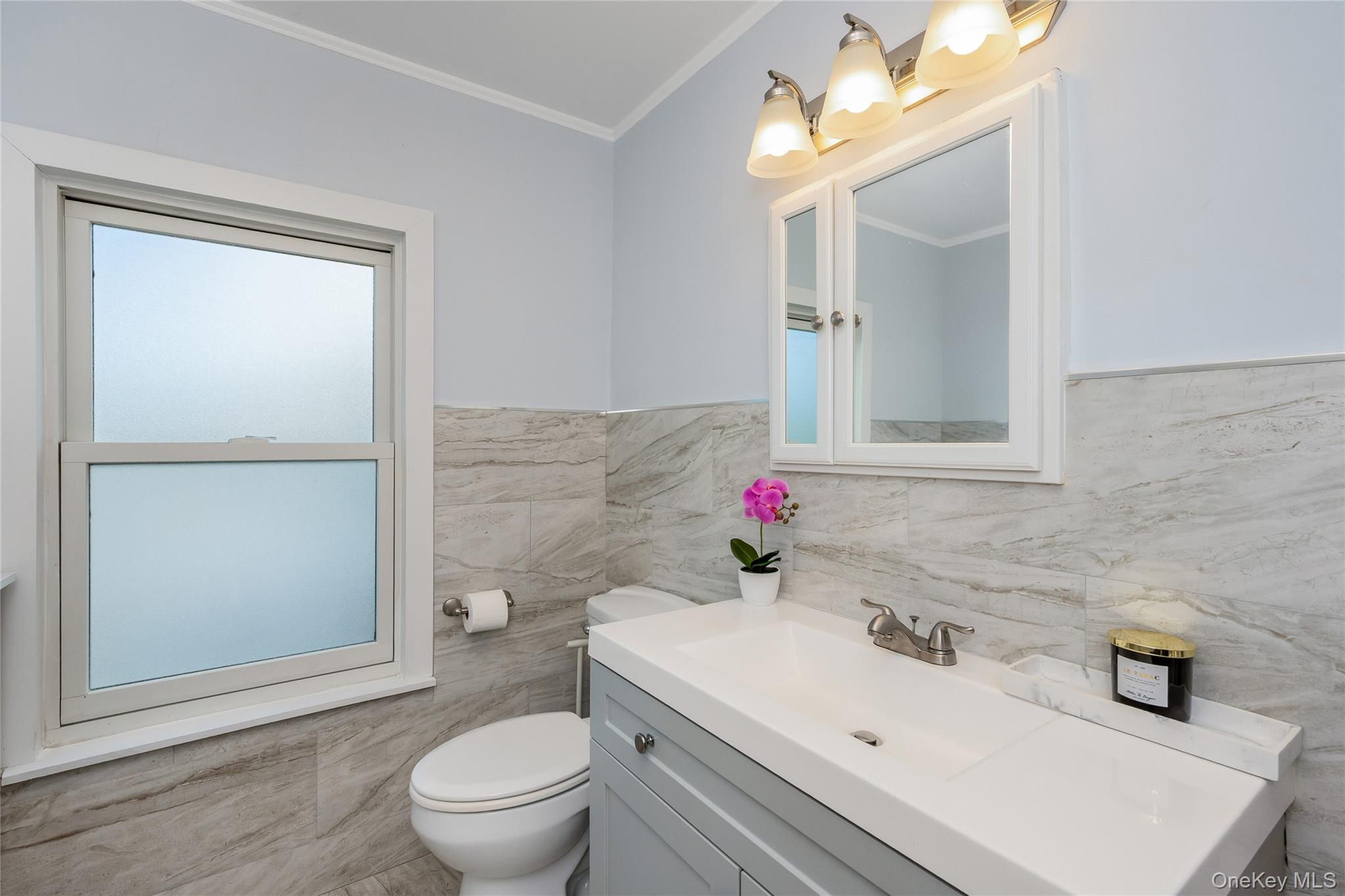 41 French Ridge New Rochelle, NY 10801 - Photo 34 of 50 a bathroom with a sink toilet vanity and mirror