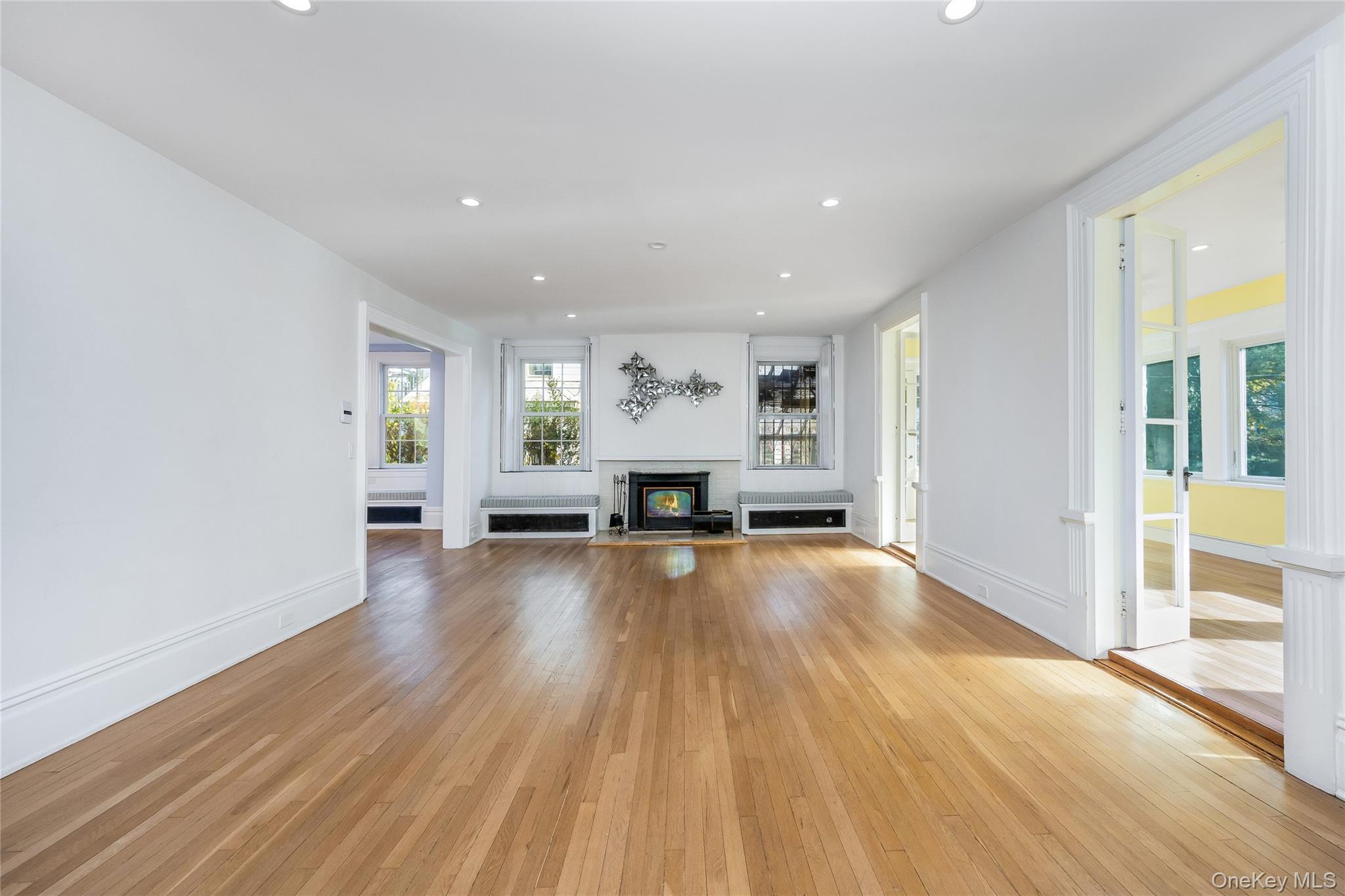 41 French Ridge New Rochelle, NY 10801 - Photo 4 of 50 a view of empty room with wooden floor and fireplace