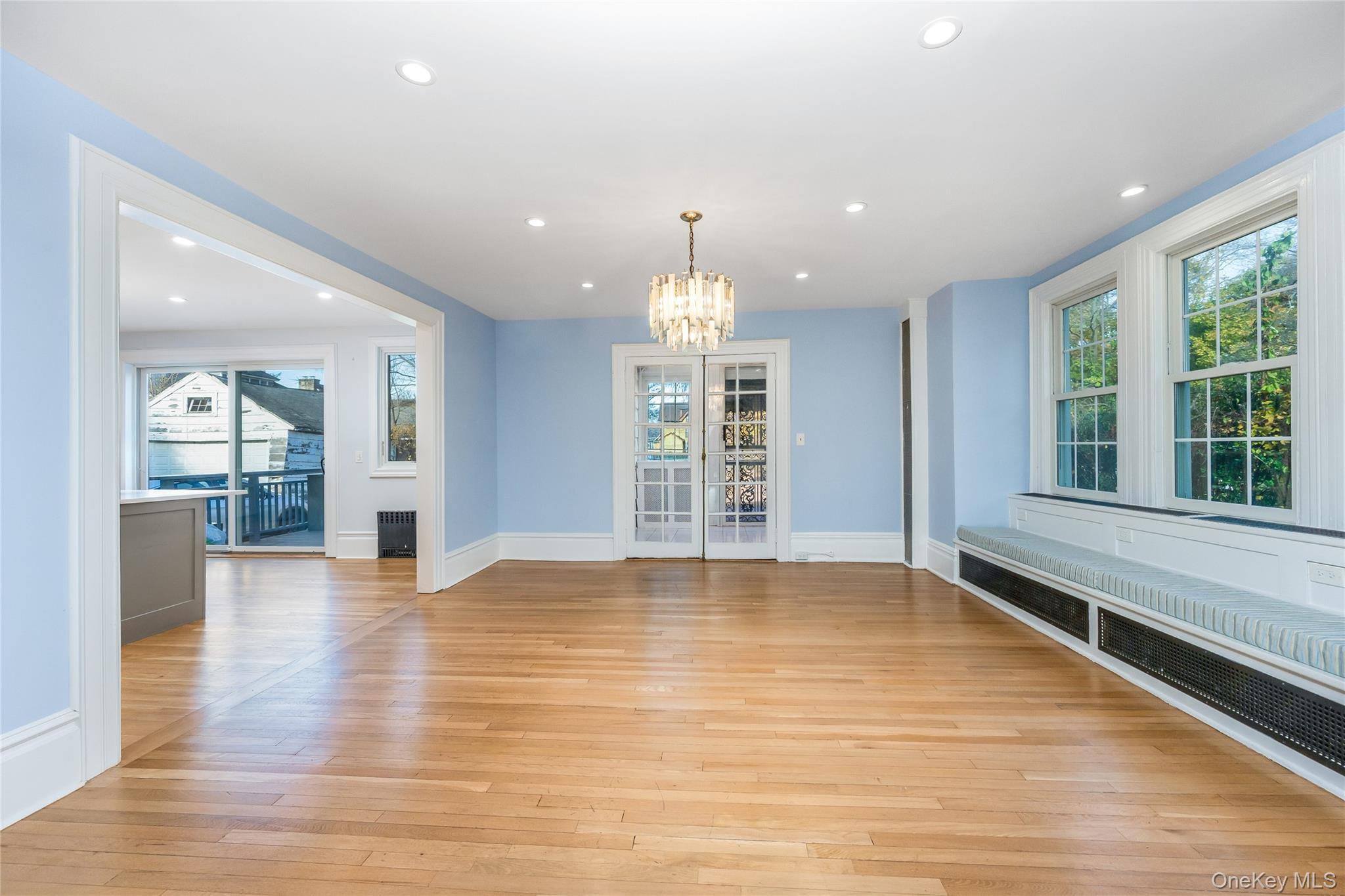 41 French Ridge New Rochelle, NY 10801 - Photo 6 of 50 a view of an empty room with wooden floor and a window