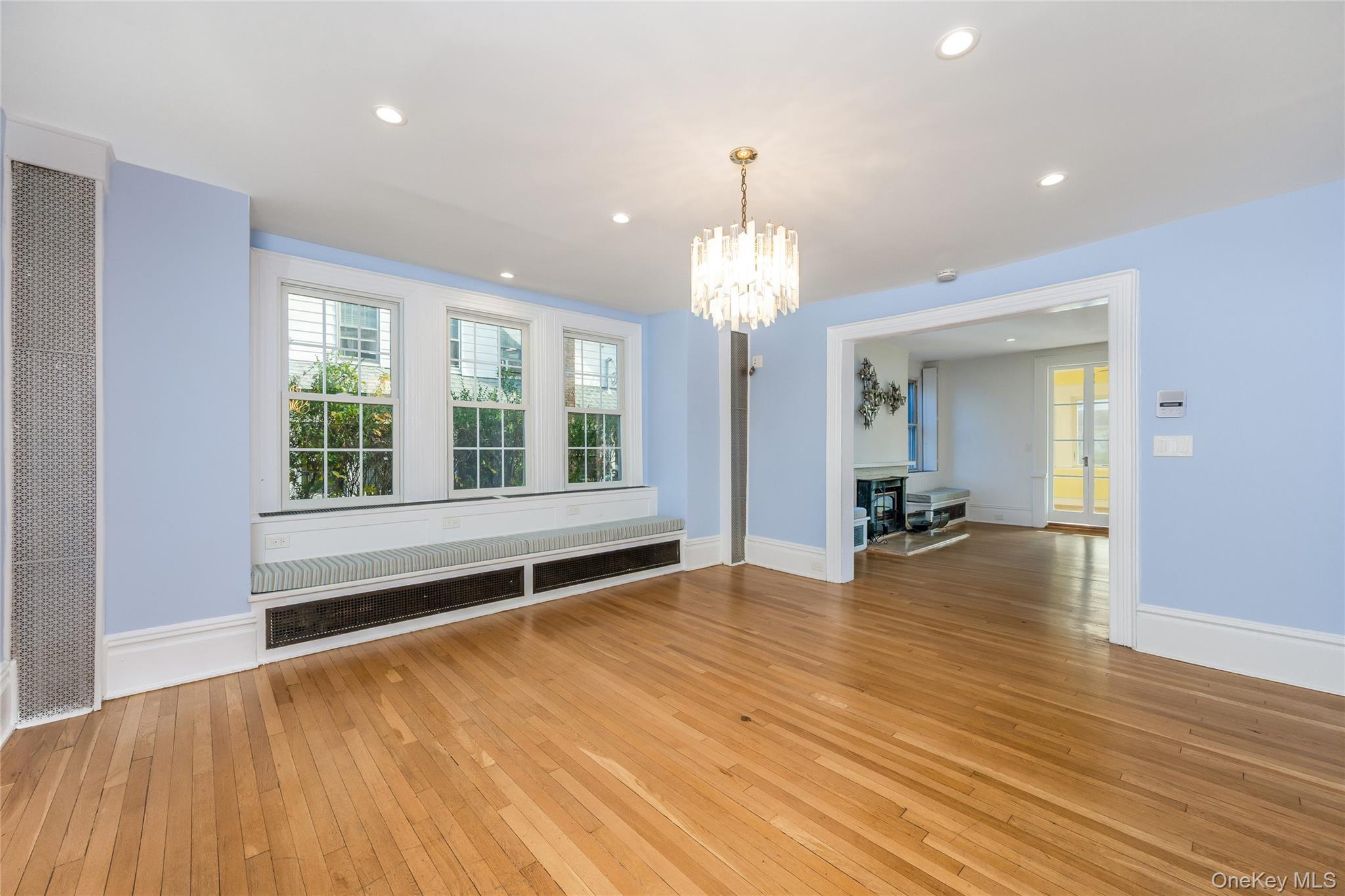 41 French Ridge New Rochelle, NY 10801 - Photo 8 of 50 a view of an empty room with wooden floor and a window