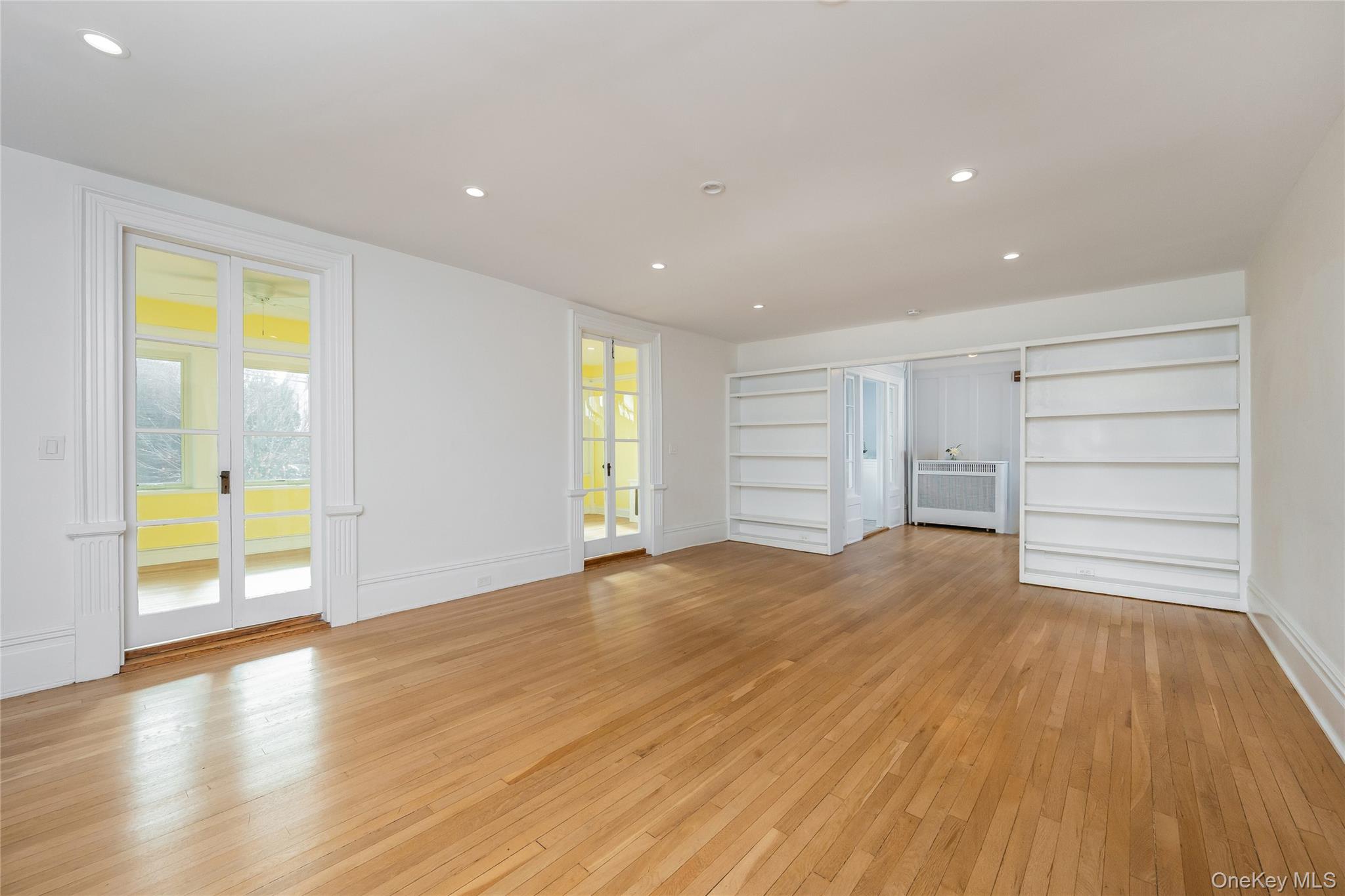 41 French Ridge New Rochelle, NY 10801 - Photo 9 of 50 a view of an empty room with a window and wooden floor