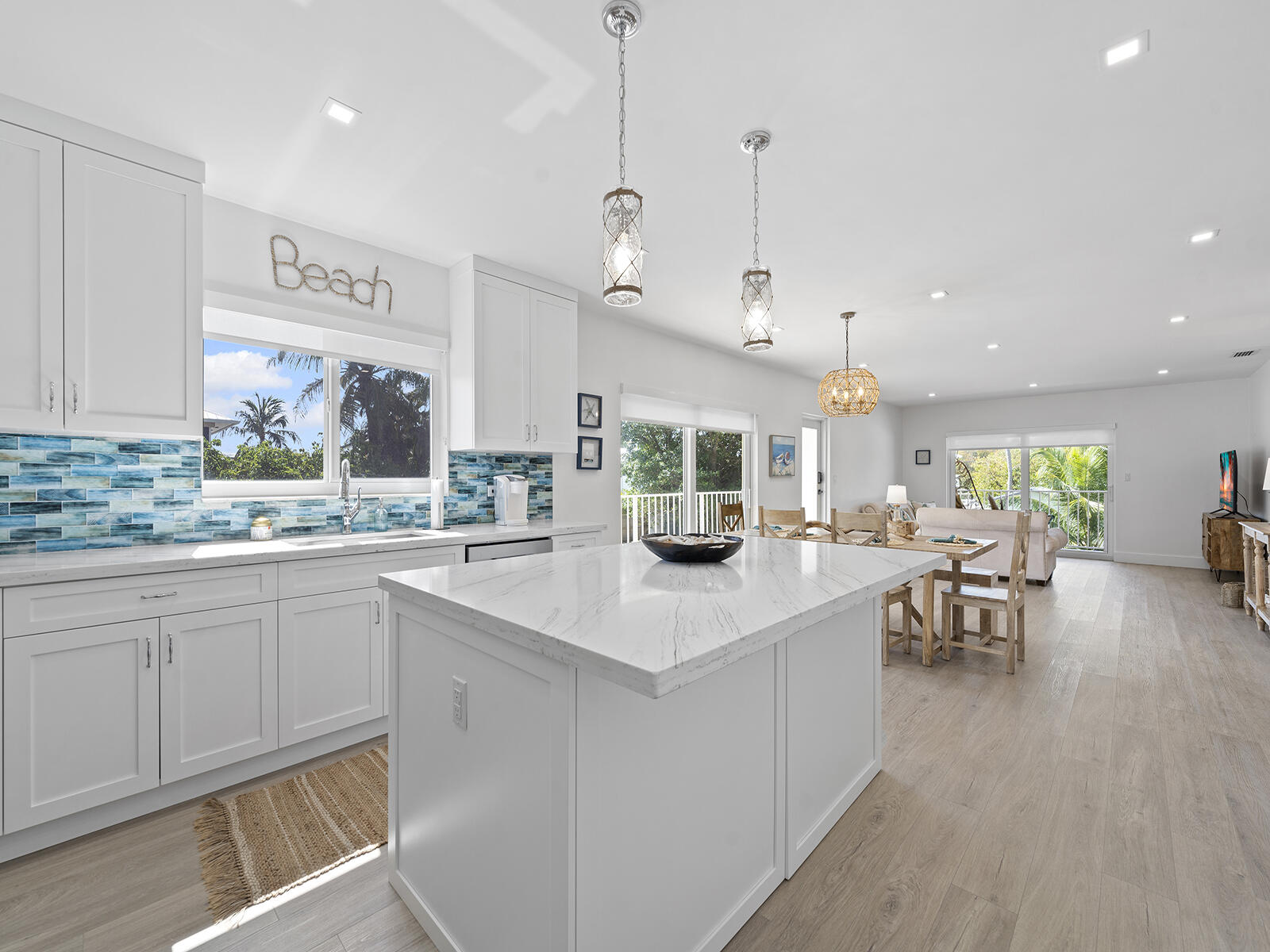 22 Atlantic Boulevard, Unit B Key Largo, FL 33037 - Photo 12 of 50 a kitchen with counter and sink
