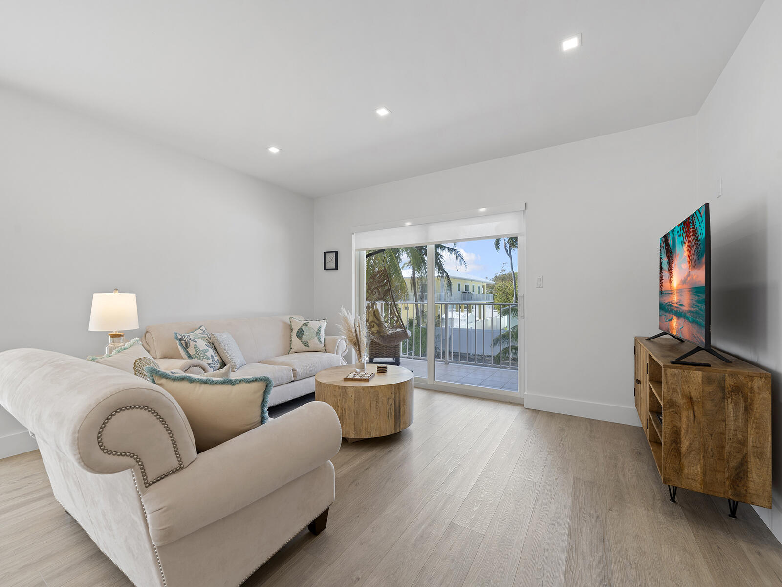 22 Atlantic Boulevard, Unit B Key Largo, FL 33037 - Photo 17 of 50 a living room with furniture and wooden floor