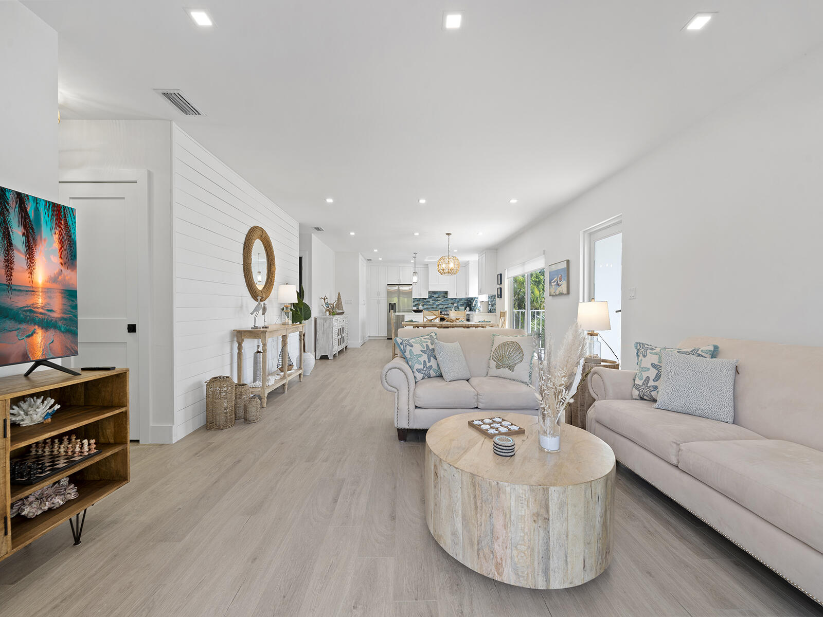 22 Atlantic Boulevard, Unit B Key Largo, FL 33037 - Photo 2 of 50 a living room with furniture and a flat screen tv