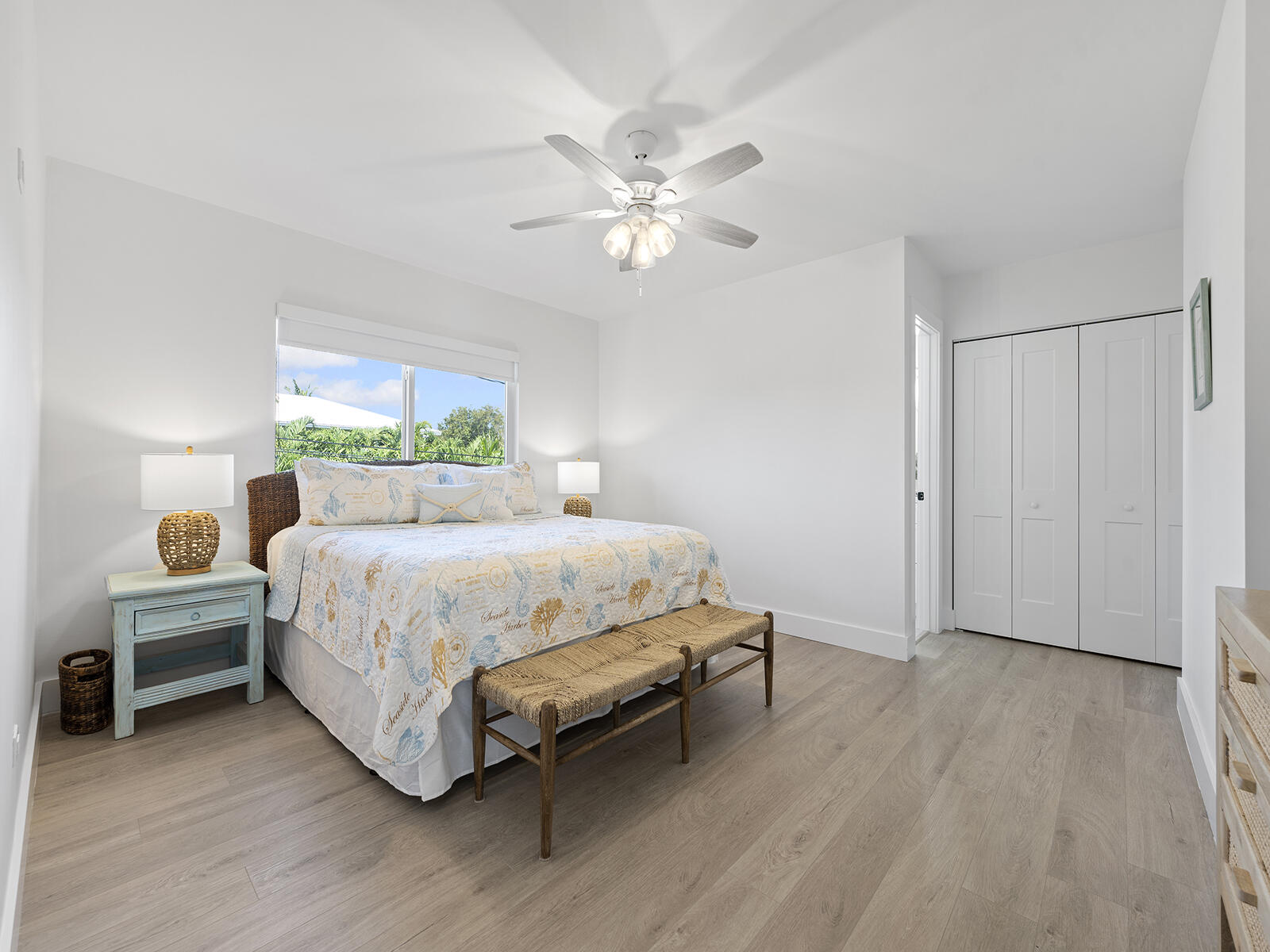 22 Atlantic Boulevard, Unit B Key Largo, FL 33037 - Photo 22 of 50 a bedroom with a bed and a chandelier