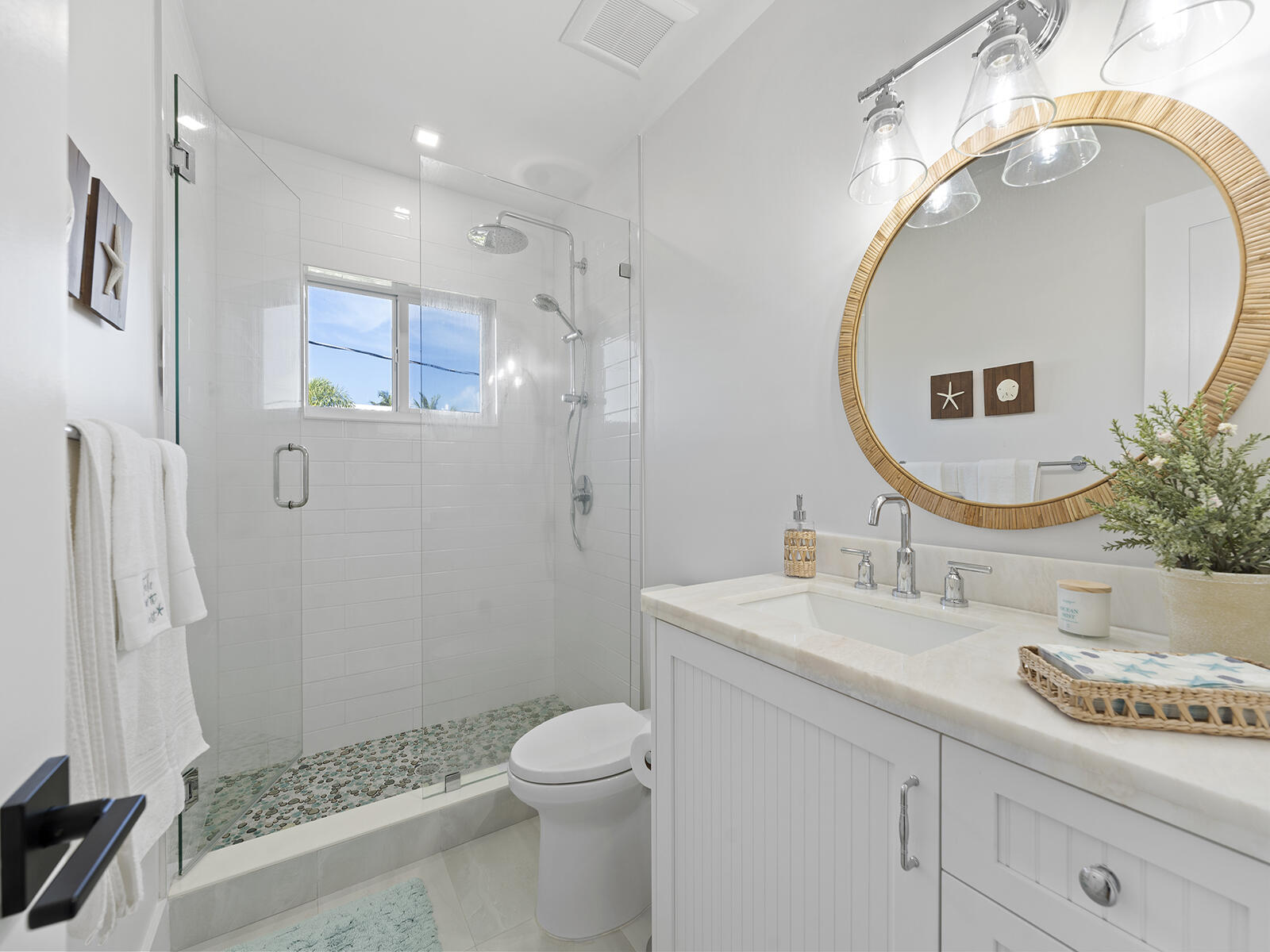 22 Atlantic Boulevard, Unit B Key Largo, FL 33037 - Photo 23 of 50 a bathroom with a sink a toilet and a mirror