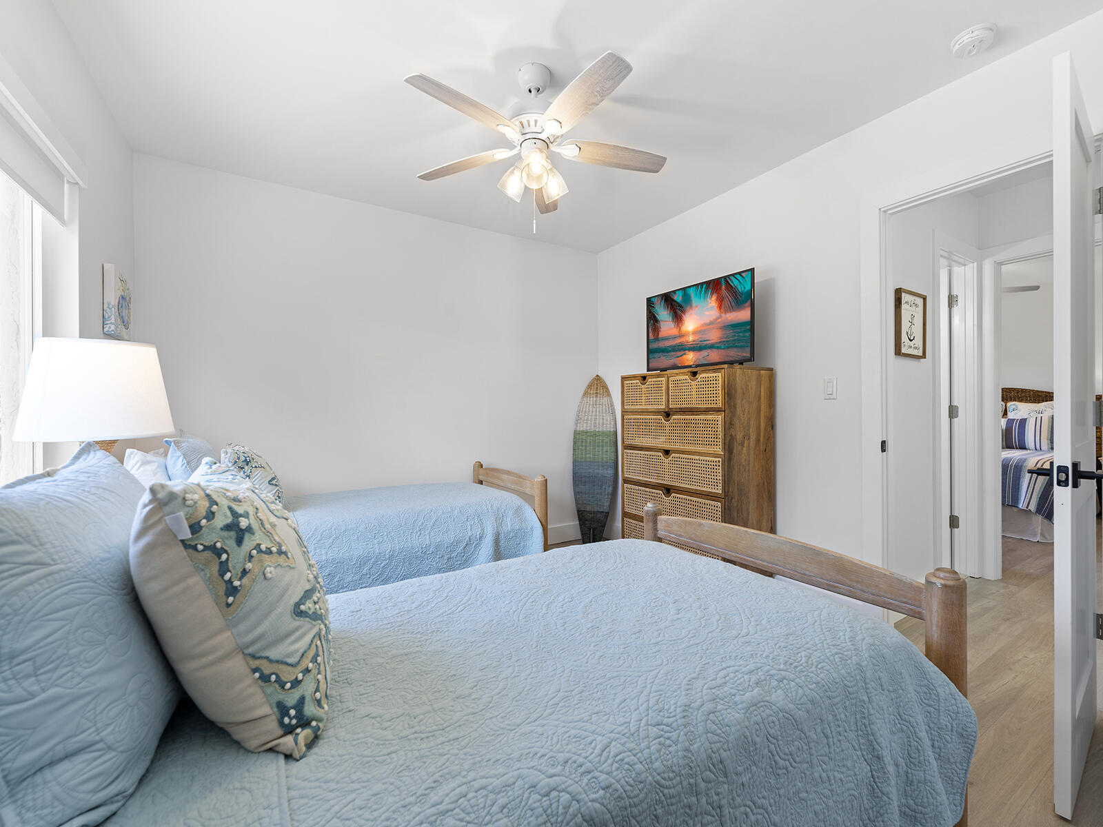 22 Atlantic Boulevard, Unit B Key Largo, FL 33037 - Photo 25 of 50 a bedroom with a large bed and a chandelier