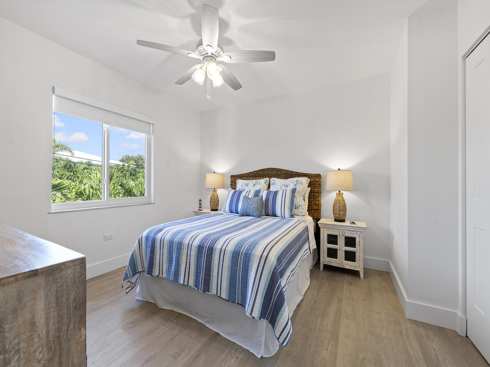 22 Atlantic Boulevard, Unit B Key Largo, FL 33037 - Photo 27 of 50 a bedroom with a bed and a chandelier