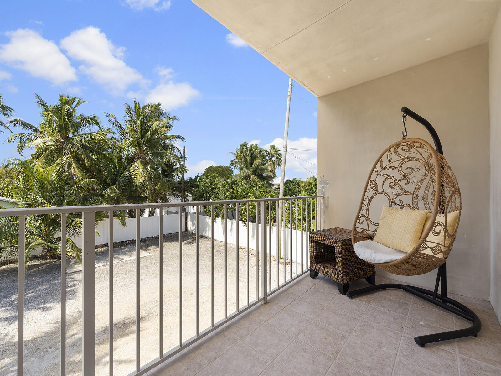 22 Atlantic Boulevard, Unit B Key Largo, FL 33037 - Photo 30 of 50 a view of a chair and table in the balcony