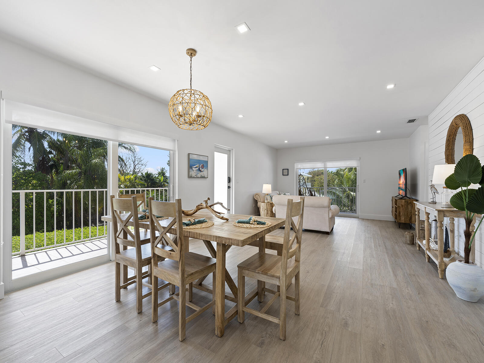 22 Atlantic Boulevard, Unit B Key Largo, FL 33037 - Photo 3 of 50 a view of a dining room with furniture window and wooden floor