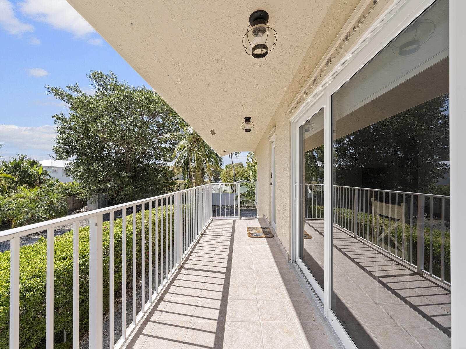 22 Atlantic Boulevard, Unit B Key Largo, FL 33037 - Photo 33 of 50 a view of balcony with wooden floor and fence