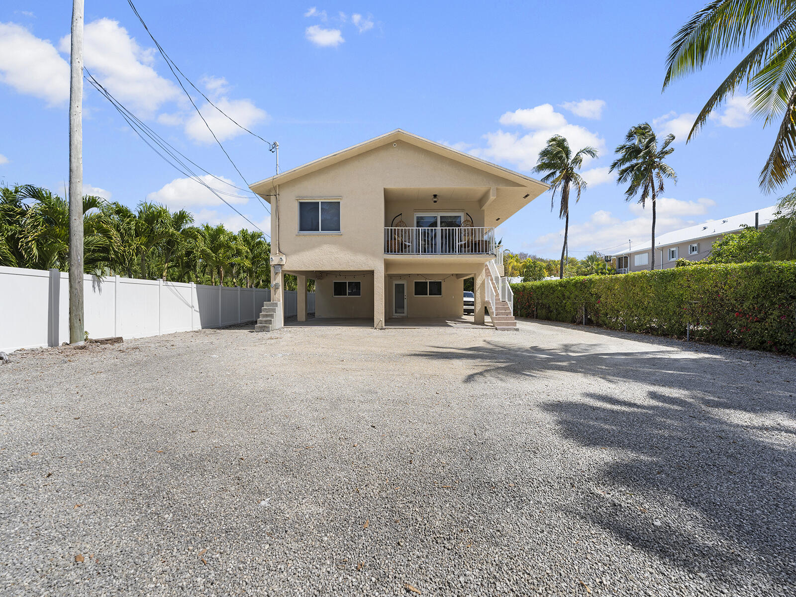 22 Atlantic Boulevard, Unit B Key Largo, FL 33037 - Photo 39 of 50 a view of house with outdoor space and palm trees
