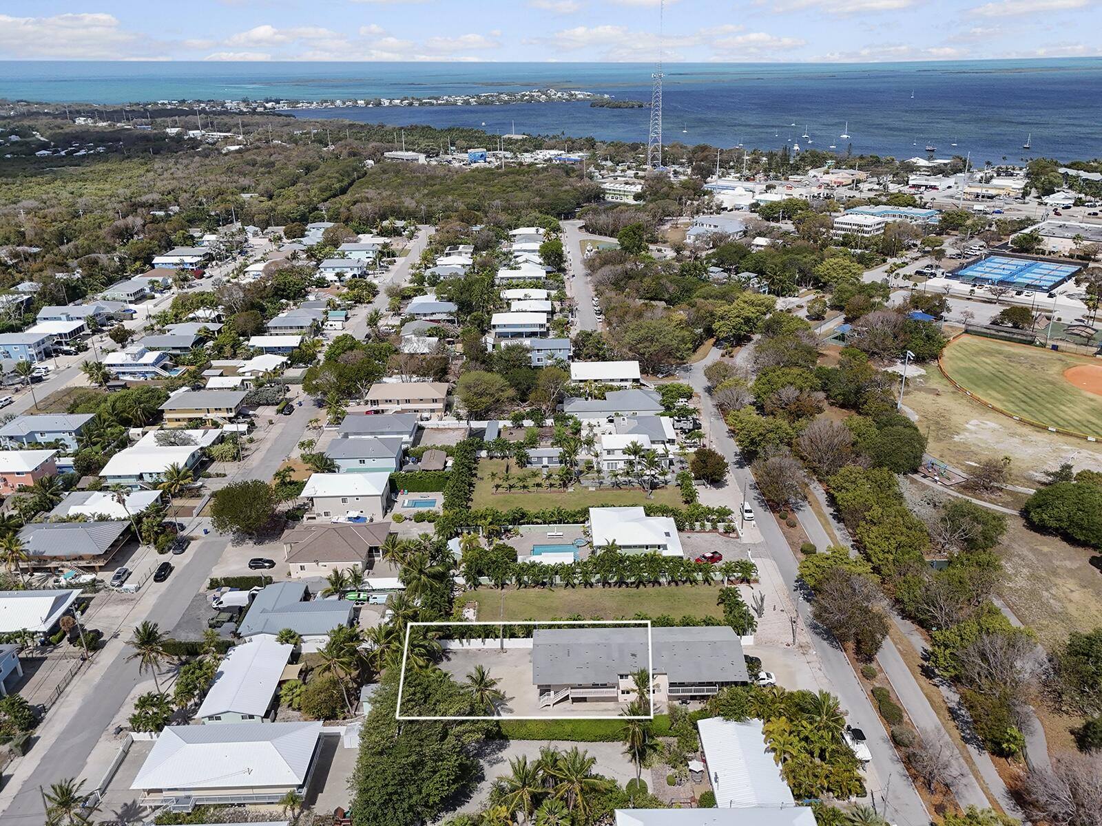 22 Atlantic Boulevard, Unit B Key Largo, FL 33037 - Photo 45 of 50 an aerial view of residential building with parking