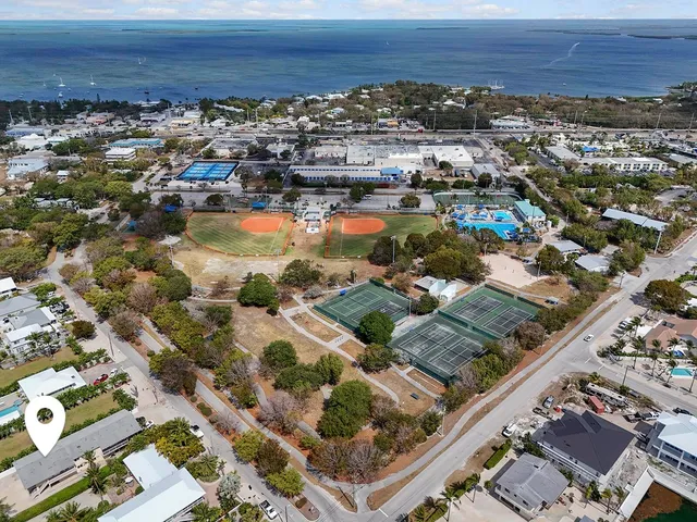 an aerial view of a city with ocean view