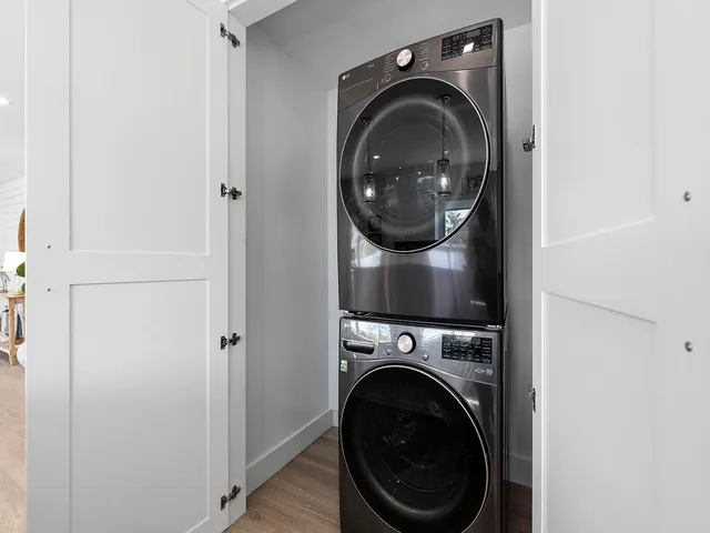 a view of a hallway with washer and dryer