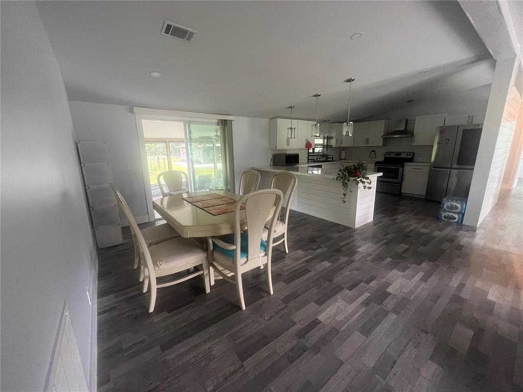 5855 Jack Brack Road St. Cloud, FL 34771 - Photo 6 of 86 a view of a dining room with furniture and a window