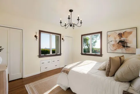 a bedroom with a bed and window